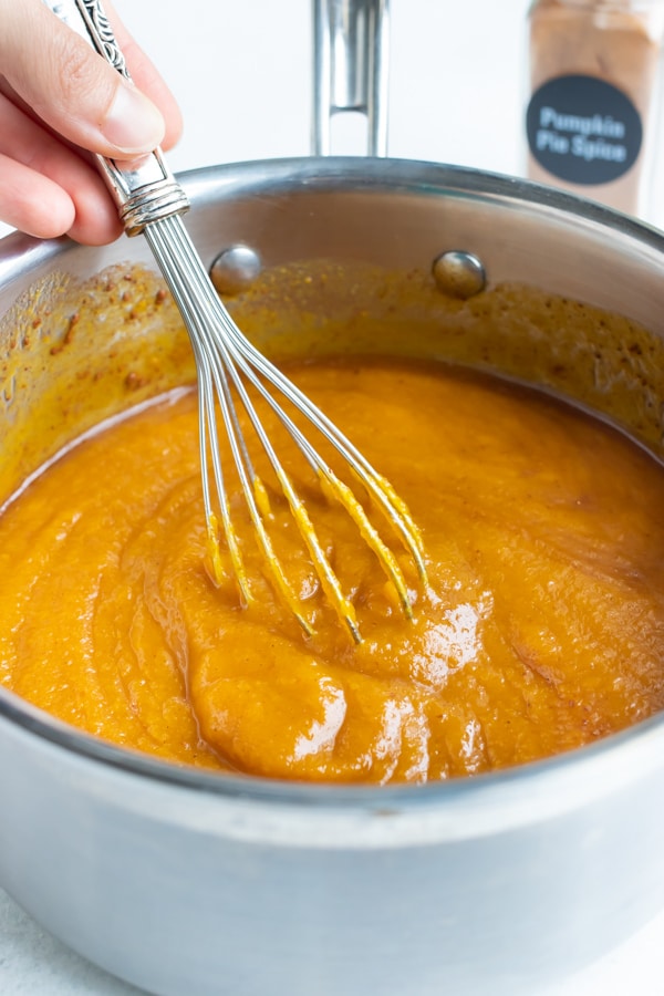 Ingredients are whisked together for this easy pumpkin butter recipe.
