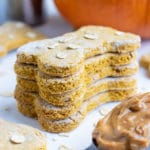 Healthy dog treats are stacked on the counter before giving to pets.