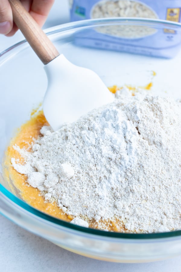 Dry ingredients are added and mixed together to form dough.