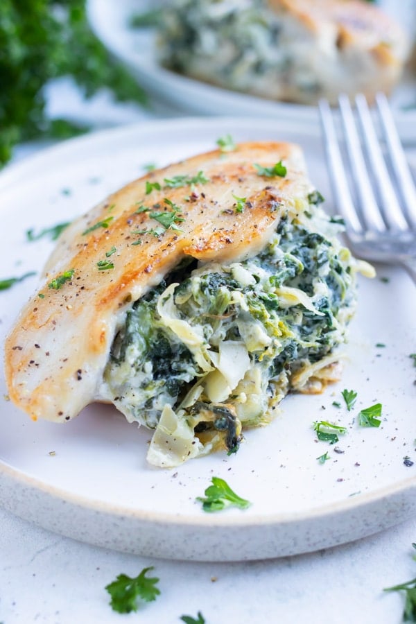 Low carb spinach artichoke chicken is served as a healthy, keto dinner.