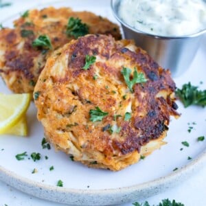 Maryland-style crab cakes are loaded with jumbo lump crabmeat and served with fresh lemon juice, parsley, and tartar sauce.