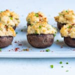 Crab stuffed mushrooms are served for a low-carb appetizer.