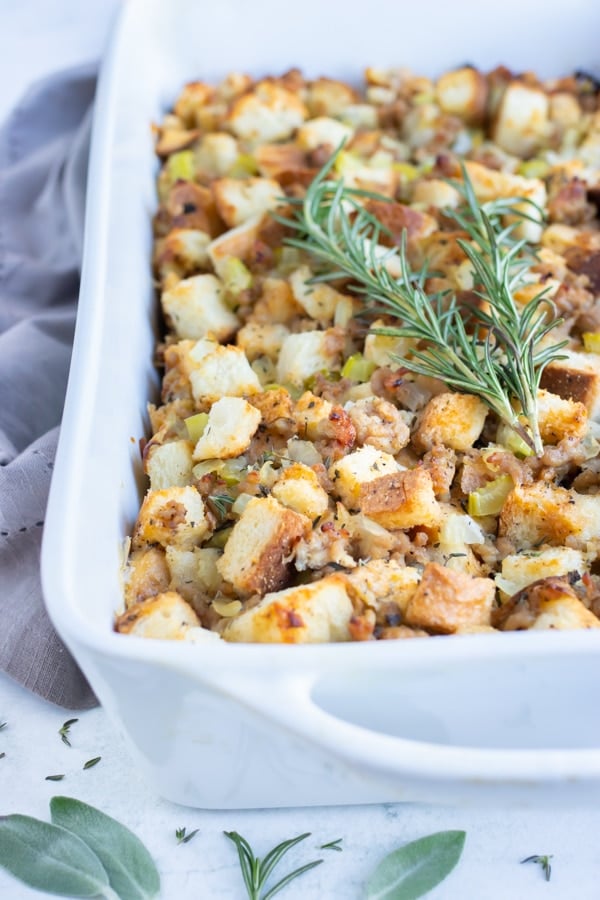 Sausage stuffing is topped with fresh herbs