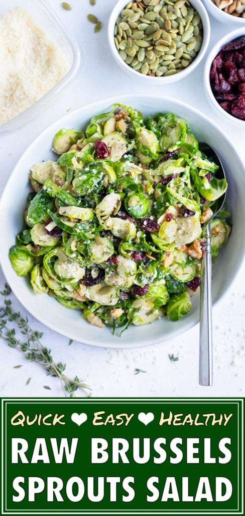 Shaved Brussels sprout salad is served with cranberries and toasted walnuts.