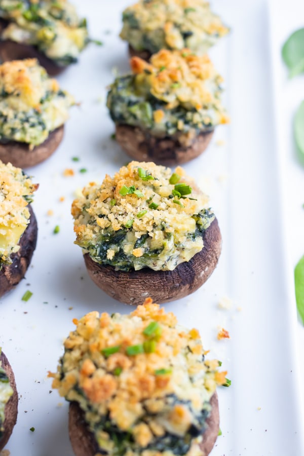 Baked stuffed mushrooms are served at a holiday party.