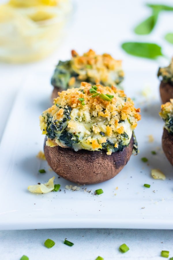 Baked spinach mushrooms are baked until golden and crisp on top for a low-carb appetizer.