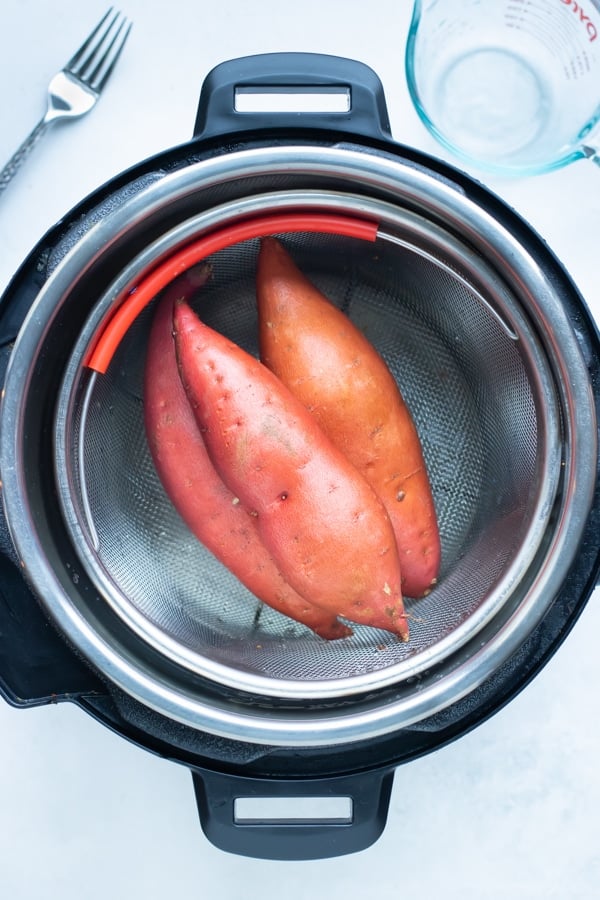 Sweet potatoes are placed in the Instant Pot.