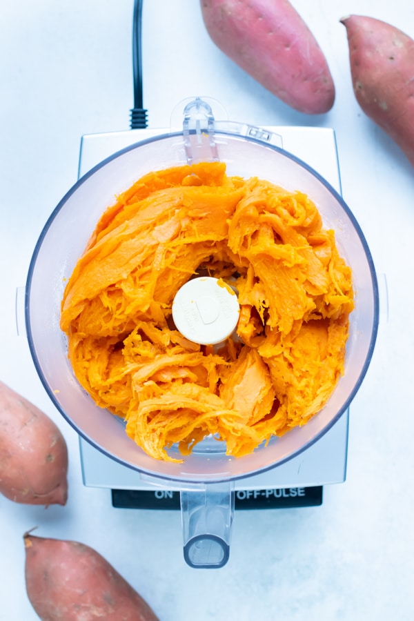 Cooked sweet potato insides are placed in the food processor.