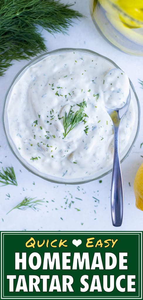 Homemade tartar sauce is served with fresh dill on top in a bowl.