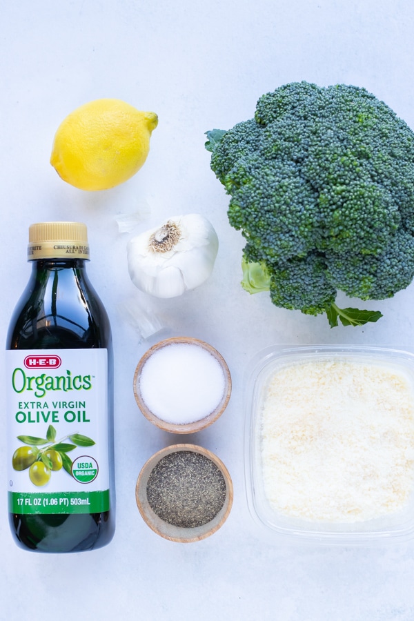 Broccoli, olive oil, lemon, garlic, parmesan, salt, and pepper are the ingredients for this recipe.