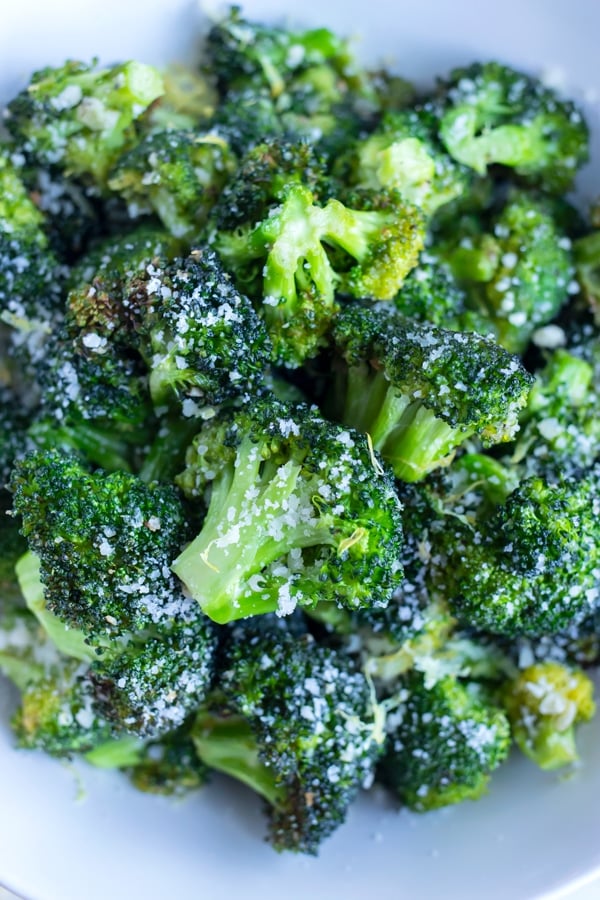 Air fryer broccoli is topped with parmesan cheese for. a low-carb and keto side.