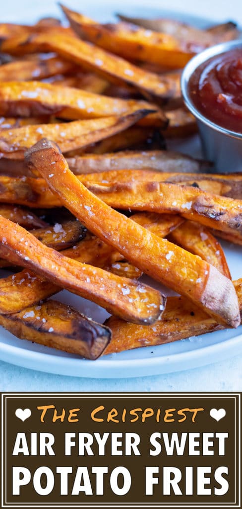 Crispy and healthy sweet potato fries made in your air fryer are served with ketchup.