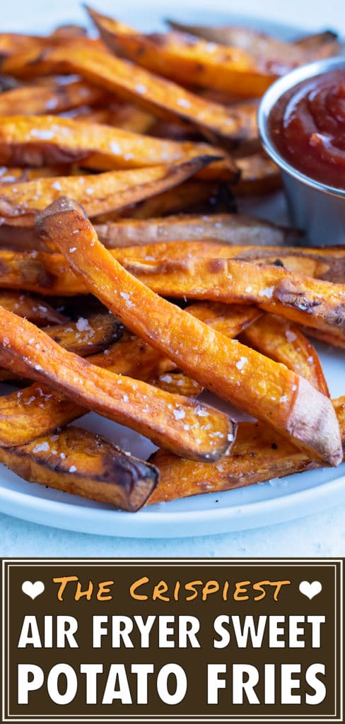 Crispy and healthy sweet potato fries made in your air fryer are served with ketchup.