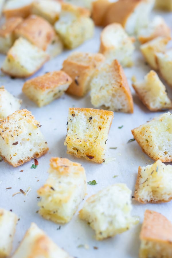 Homemade croutons are flavored with herbs and garlic for a quick soup topping.