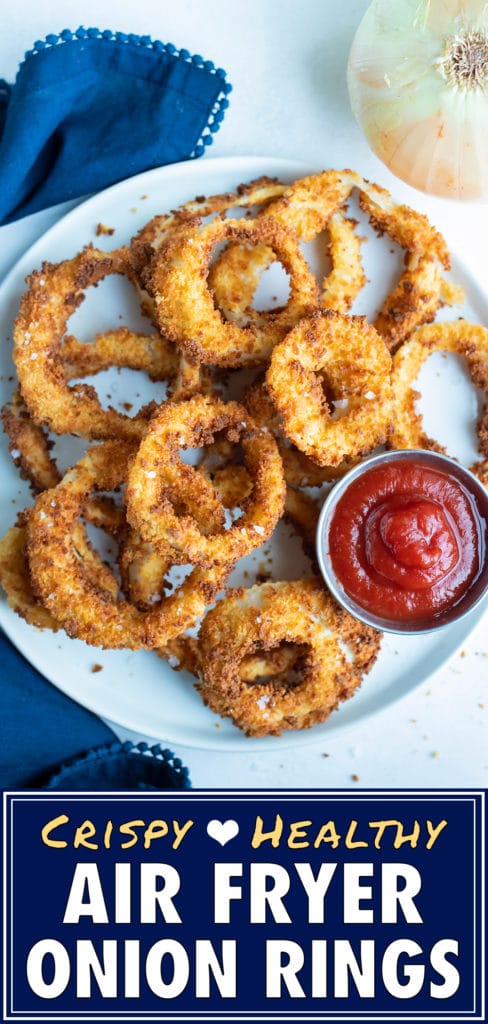 Air Fryer onion rings are served with ketchup for a party appetizer.
