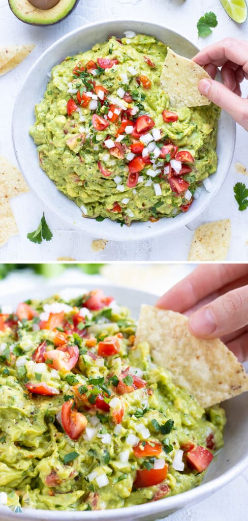 A bowl full of an easy guacamole recipe with tomatoes and cilantro on top.
