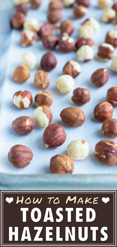 Roasted hazelnuts are made in the oven on a lined baking sheet.