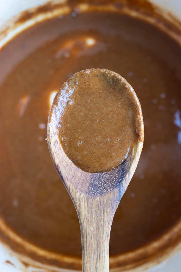 Roux is shown on a wooden spoon.