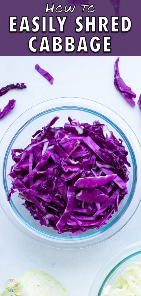 A bowl full of shredded red cabbage next to two cut cabbage wedges.