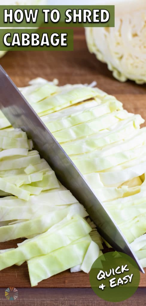 A knife cutting cabbage into thin 1-inch pieces.