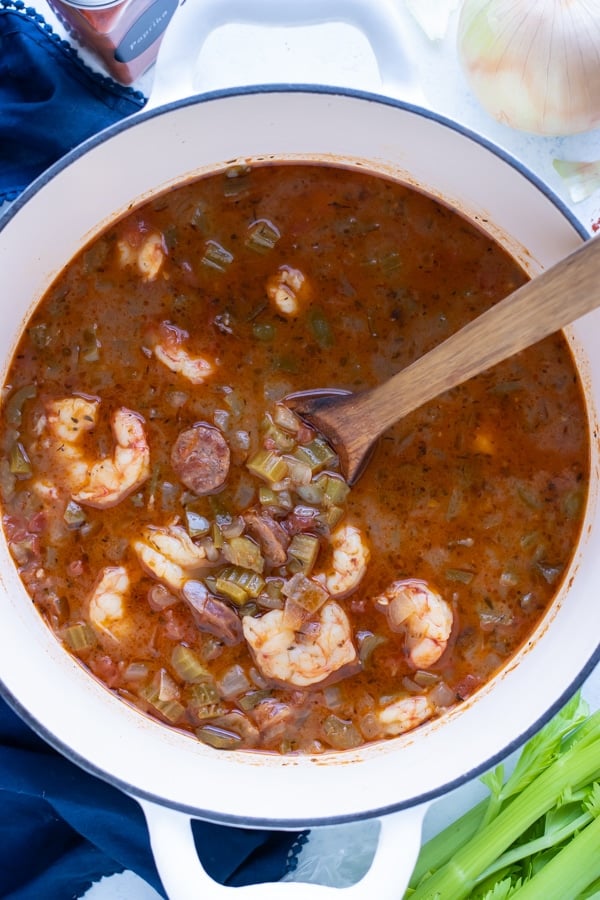 Shrimp and sausage gumbo is shown in a pot