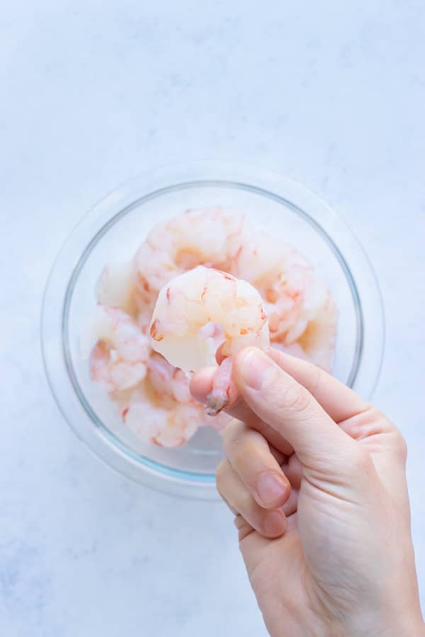 Raw jumbo shrimp that have been peeled and deveined for a shrimp taco recipe.