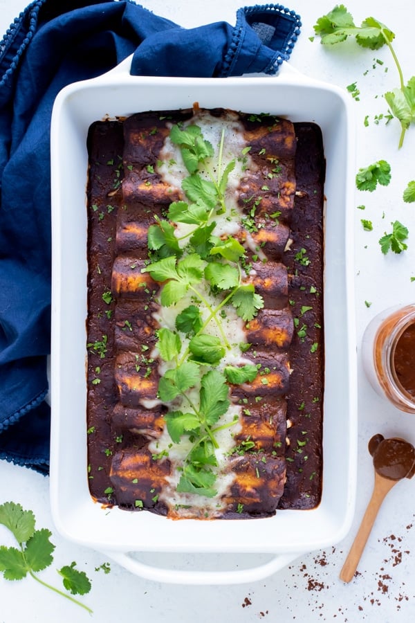 Chicken Mole Enchiladas are set on the counter for a gluten-free dinner.
