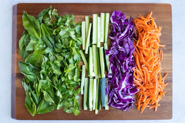All fresh vegetables are chopped and prepared for the roll. 