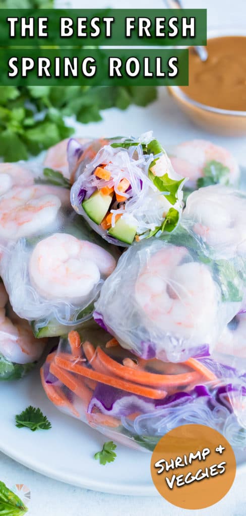 A full plate of fresh spring rolls is shown on a plate.