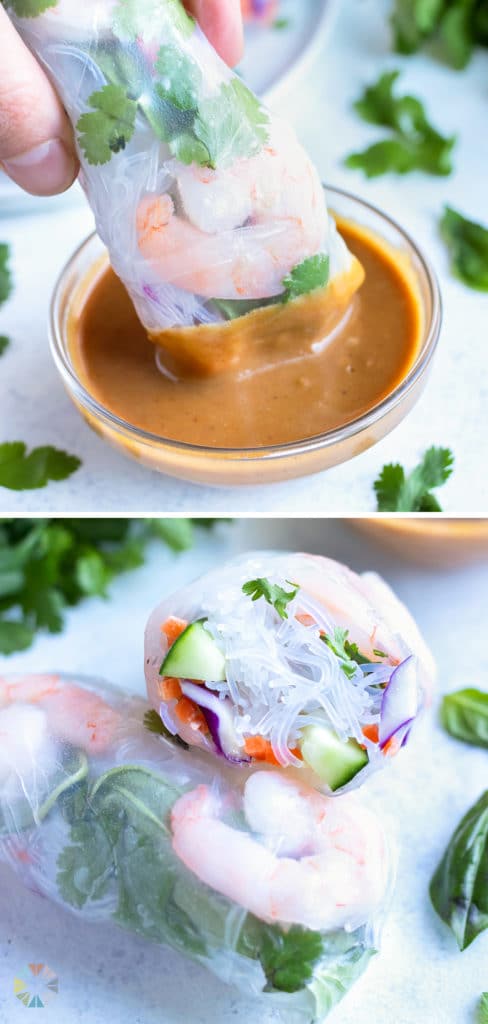 A spring roll is dipped into a homemade peanut sauce.