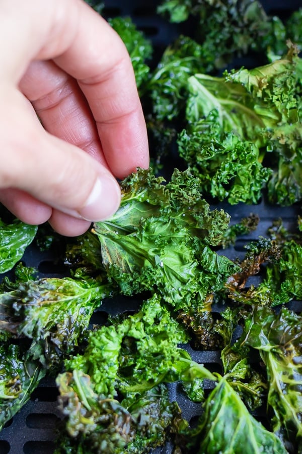 Crispy air fryer kale chips are enjoyed for a healthy snack.