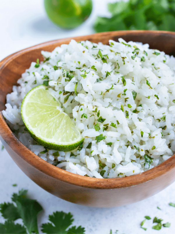 A side of cilantro lime rice is served for dinner from a bowl.
