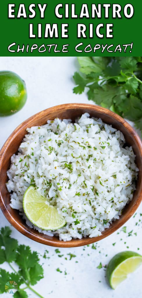 Fresh cilantro and a lime wedge is served with a bowl of cilantro rice.