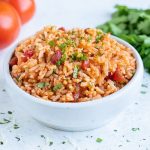 Instant pot Mexican rice is served in a big white bowl.