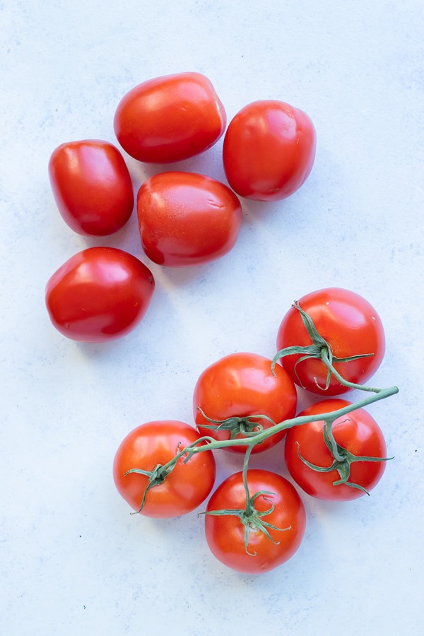 Roma and vine tomatoes are shown for this salsa recipe.