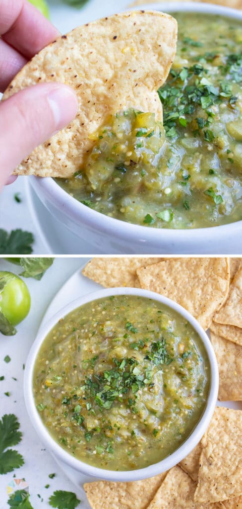 A chip is dipped into a white bowl filled with tomatillo salsa.
