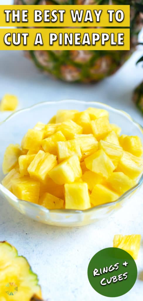 A bowl of pineapple cubes are set on the counter.