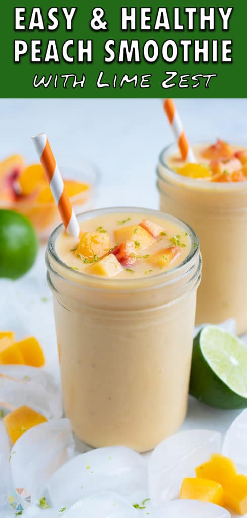 Thick and creamy peach shake is served in a glass cup with a straw.