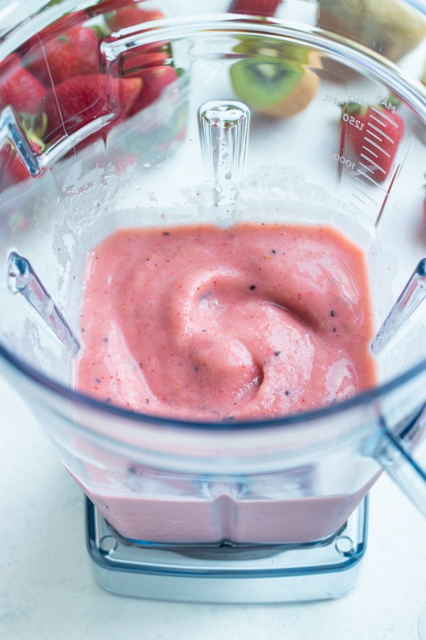 Strawberry and kiwi smoothie is made in a high speed blender for the best texture.