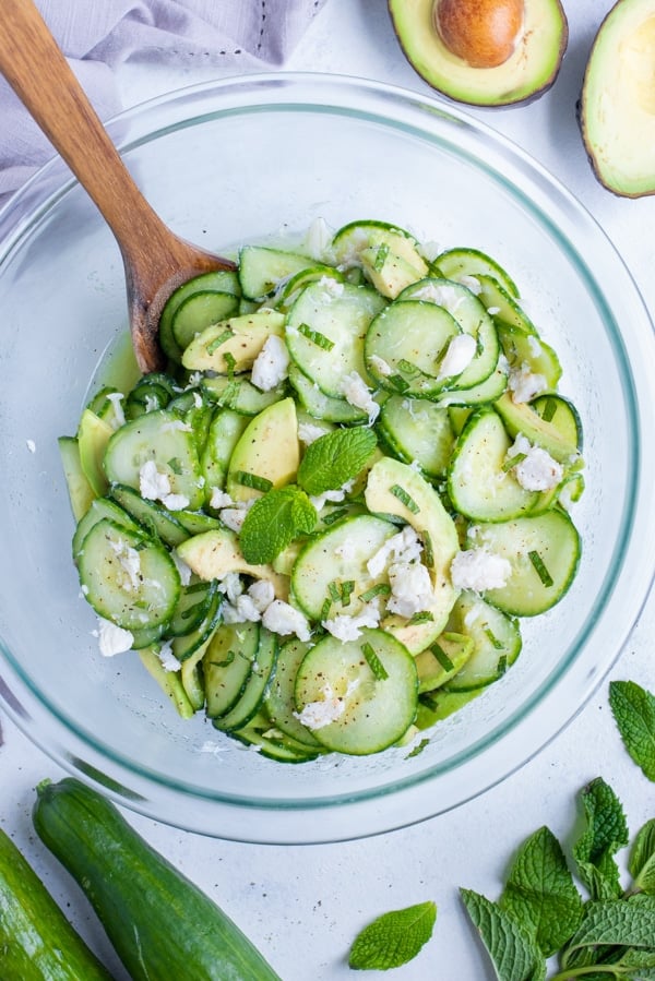 All the ingredients are combined and mixed together in a glass bowl.