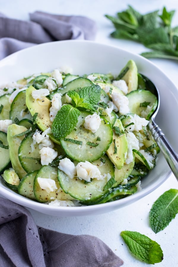 Cucumber crab salad is served for a low-carb, paleo salad.