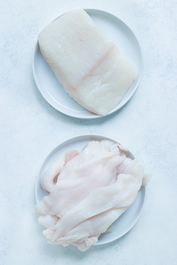 Cod fillets and other types of white fish are shown for this recipe.