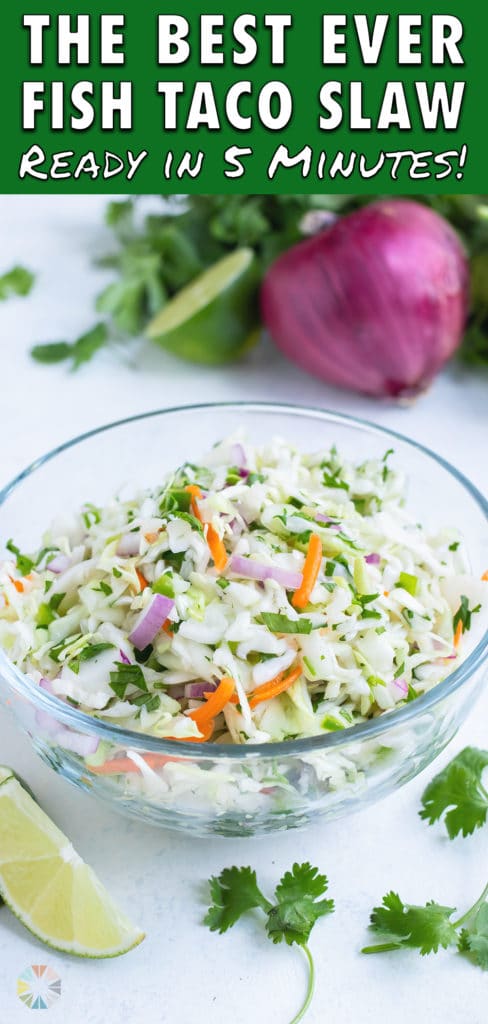Low-carb taco slaw is served from a glass bowl on the counter.