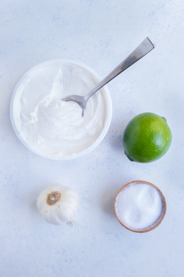 Mexican crema, lime, garlic, and salt are the ingredients for this recipe.