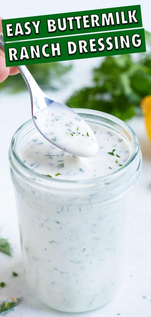 Homemade ranch dip is served from a jar with a spoon.