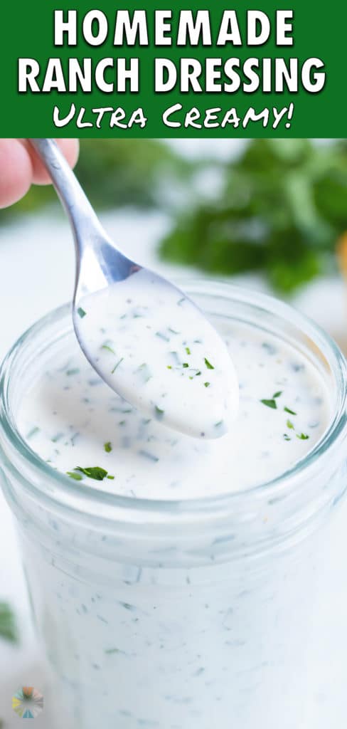 The ranch dressing is lifted up by a spoon.