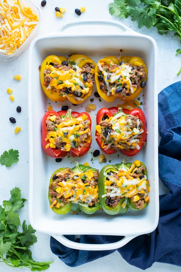 Taco stuffed bell peppers are shown on the counter.