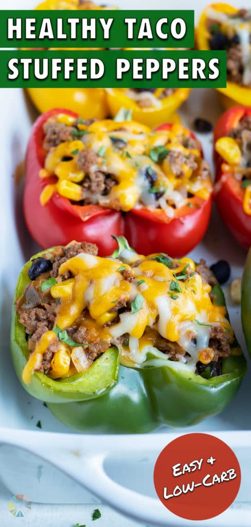 Mexican stuffed bell peppers are served from a white dish.