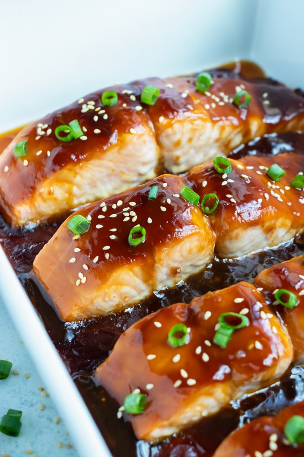 Teriyaki salmon is covered with sweet and tangy teriyaki sauce and sesame seeds.