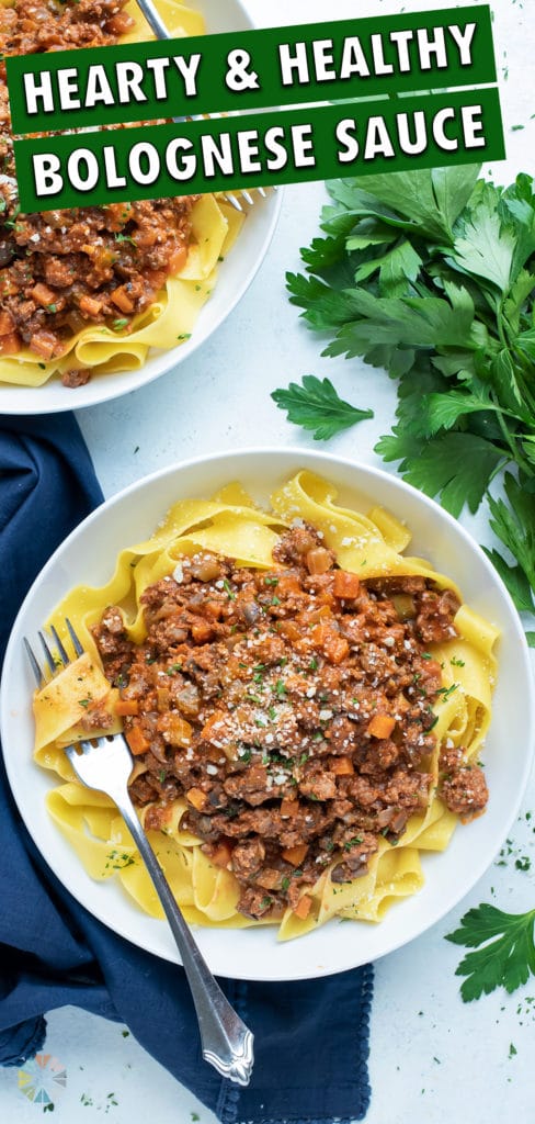 Italian beef Bolognese is served on a white plate.